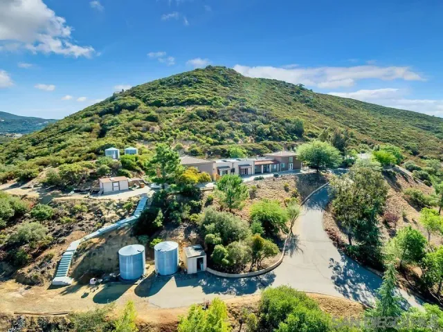 a view of a garden with a building in the background