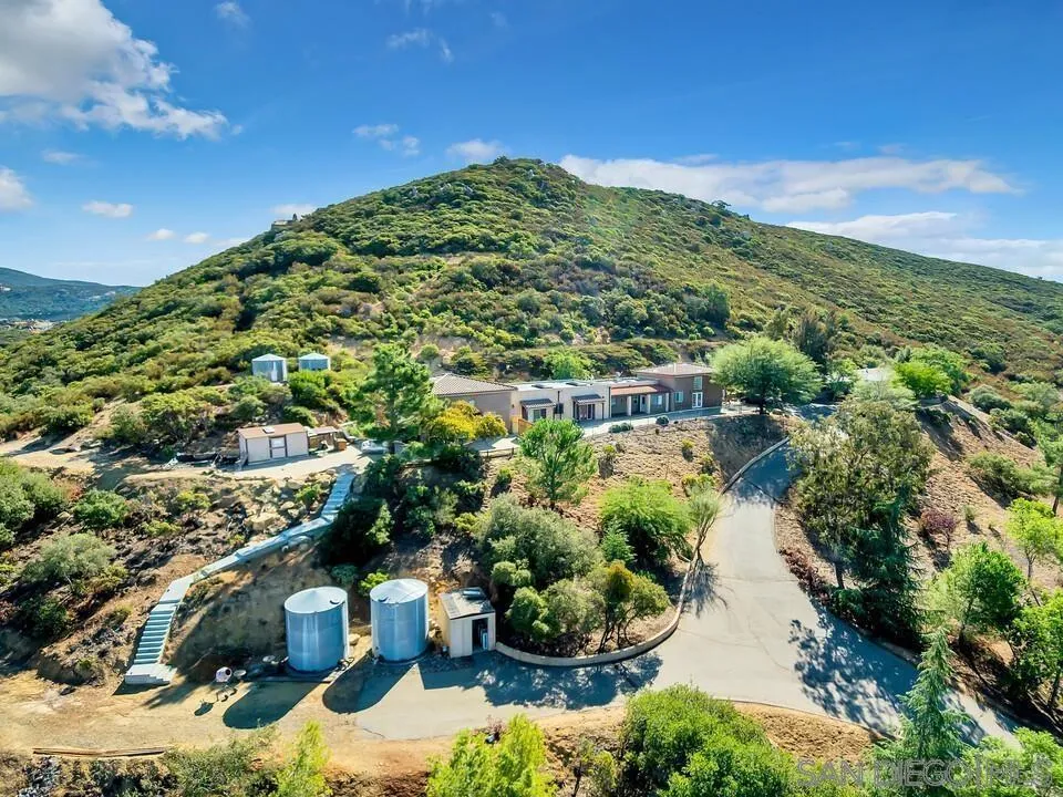 23611-13 Old Ranch Road Alpine, CA 91901 - Photo 6 of 25 a view of a garden with a building in the background