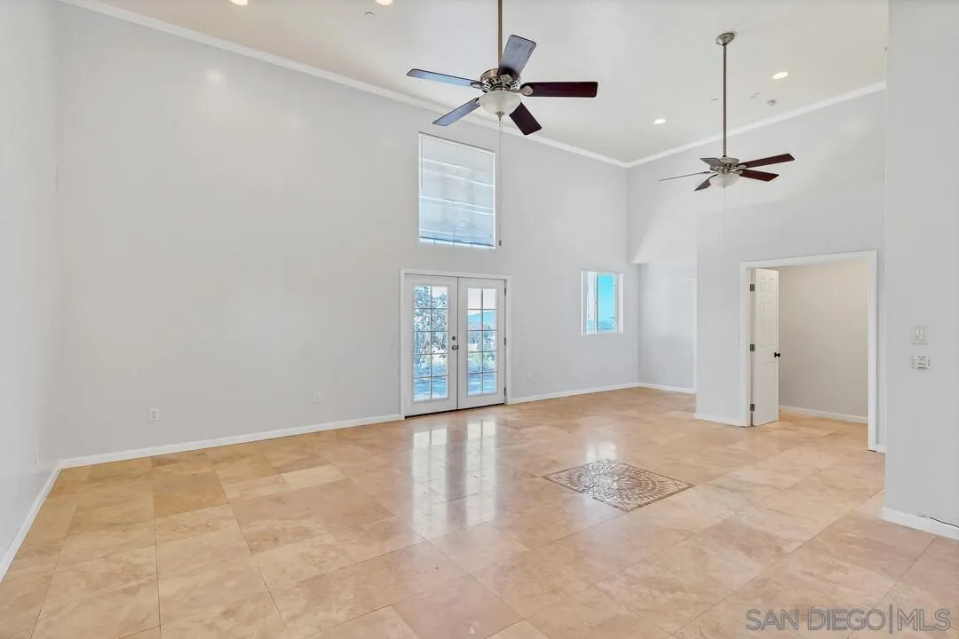 23611-13 Old Ranch Road Alpine, CA 91901 - Photo 8 of 25 an empty room with windows and fan