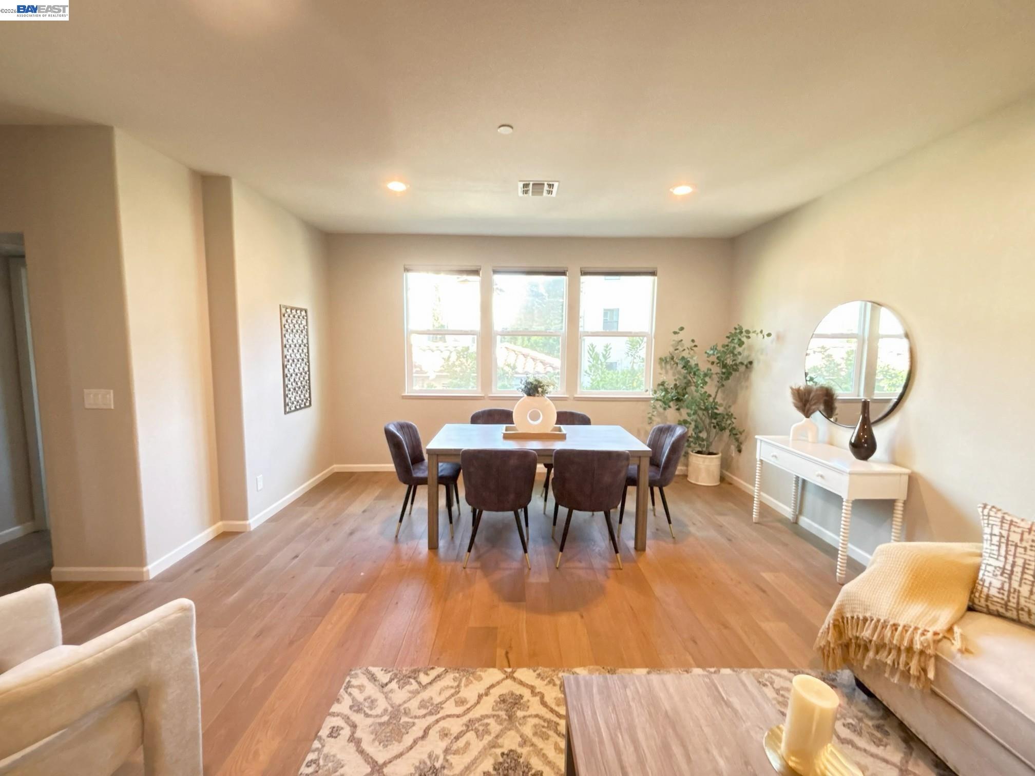 1270 Gusty Loop, Unit 3 Livermore, CA 94550 - Photo 16 of 41 a view of a dining room with furniture and wooden floor