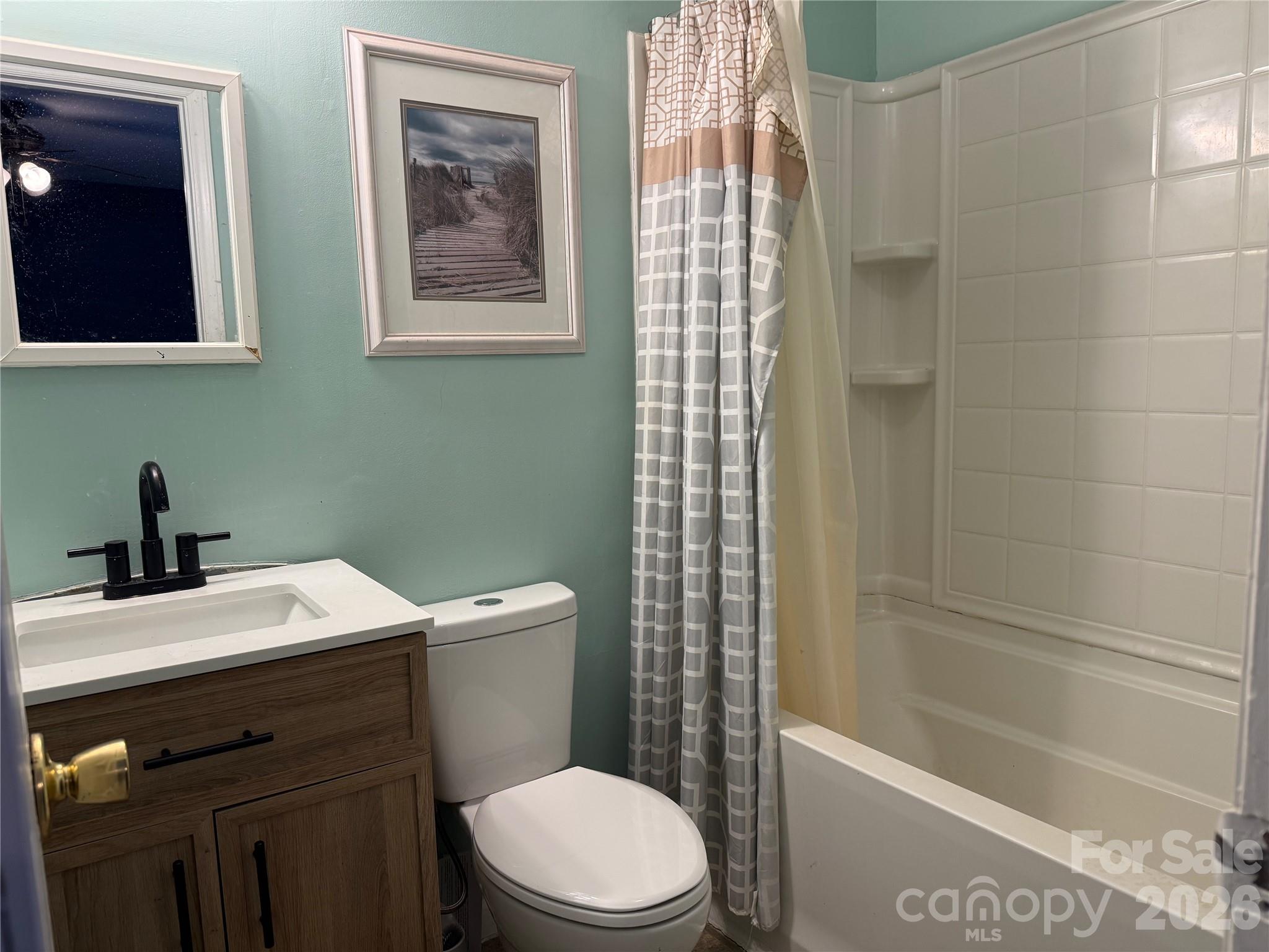 309 Mel Lane Crouse, NC 28033 - Photo 21 of 35 a bathroom with a sink a toilet and shower
