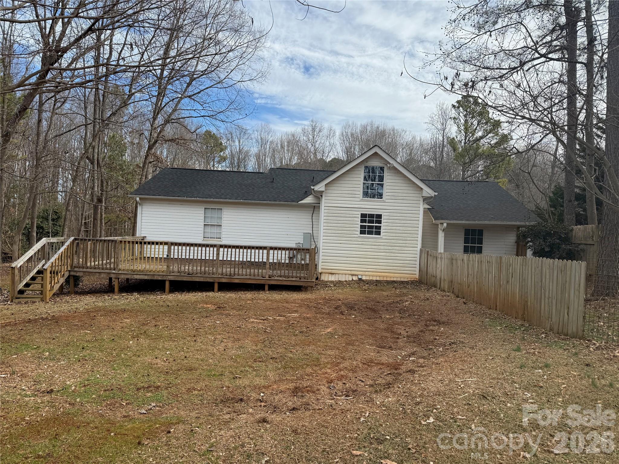 309 Mel Lane Crouse, NC 28033 - Photo 29 of 35 a house with trees in front of it