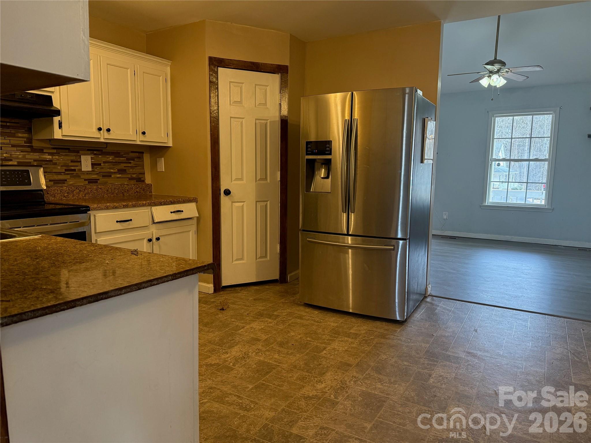 309 Mel Lane Crouse, NC 28033 - Photo 9 of 35 a kitchen with stainless steel appliances granite countertop a refrigerator a stove and a sink