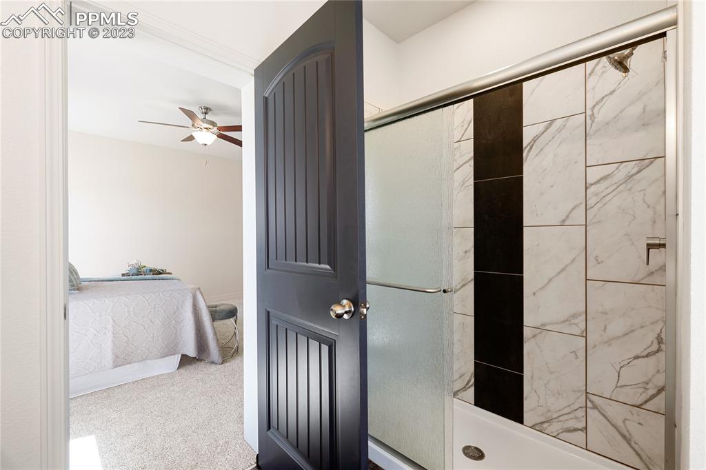 208 High Meadows Drive Florence, CO 81226 - Photo 20 of 32 a bathroom with a shower and a tub