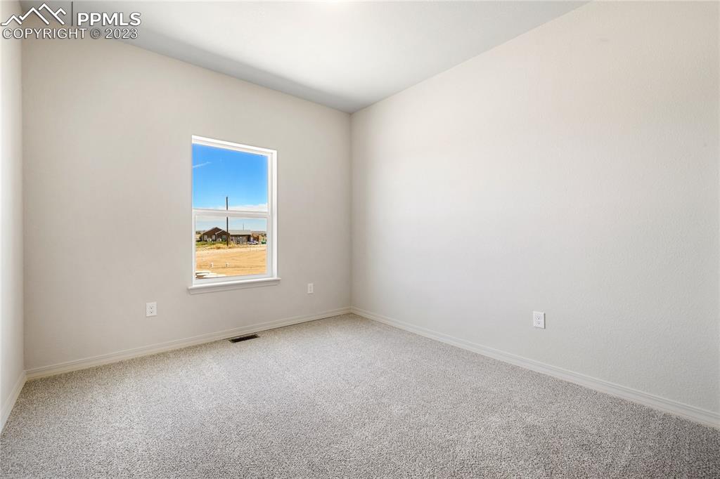 208 High Meadows Drive Florence, CO 81226 - Photo 28 of 32 a view of an empty room with a window