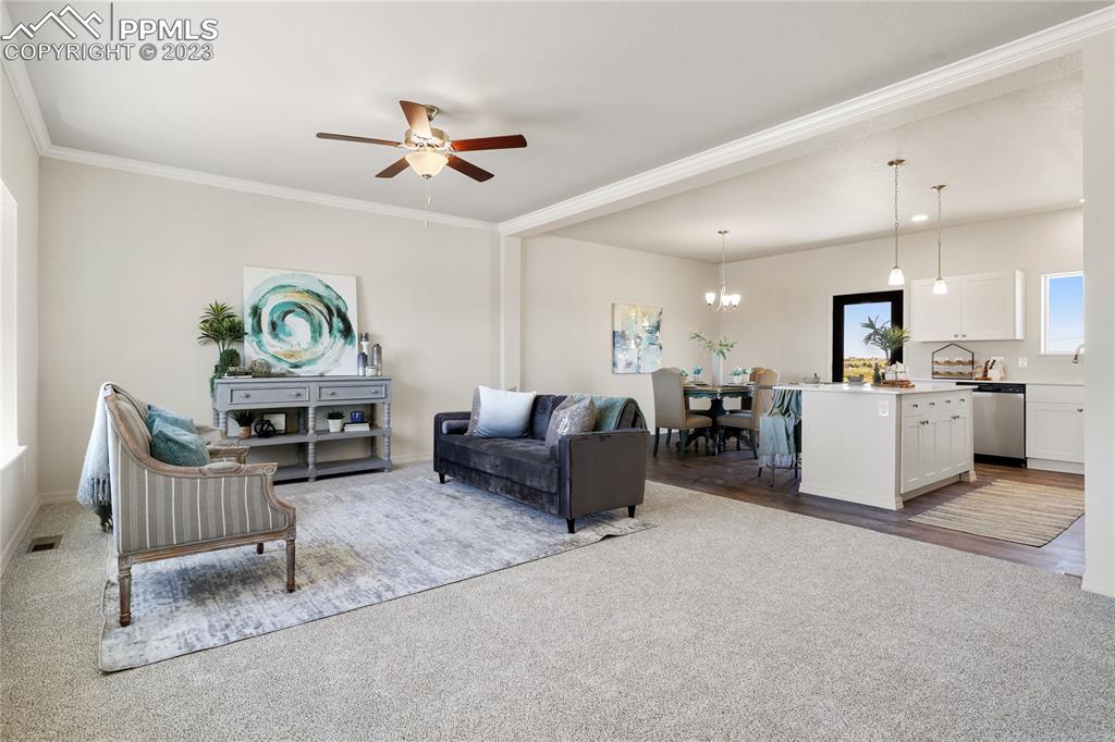 208 High Meadows Drive Florence, CO 81226 - Photo 3 of 32 a living room with furniture and kitchen view