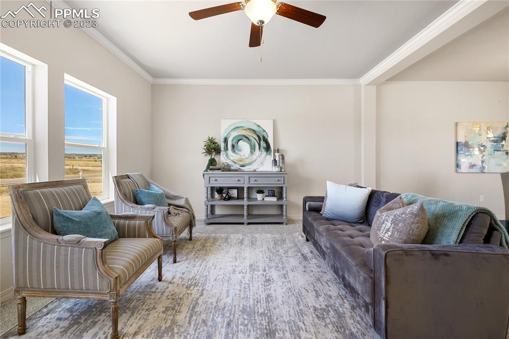 208 High Meadows Drive Florence, CO 81226 - Photo 4 of 32 a living room with furniture and a large window