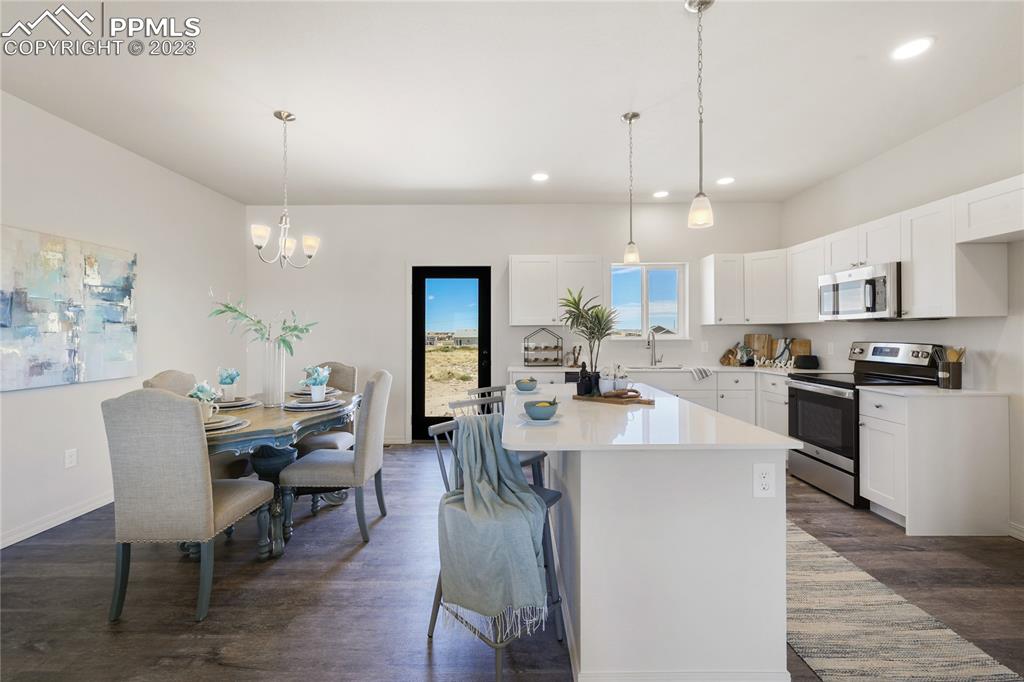 208 High Meadows Drive Florence, CO 81226 - Photo 5 of 32 a view of a dining room with furniture