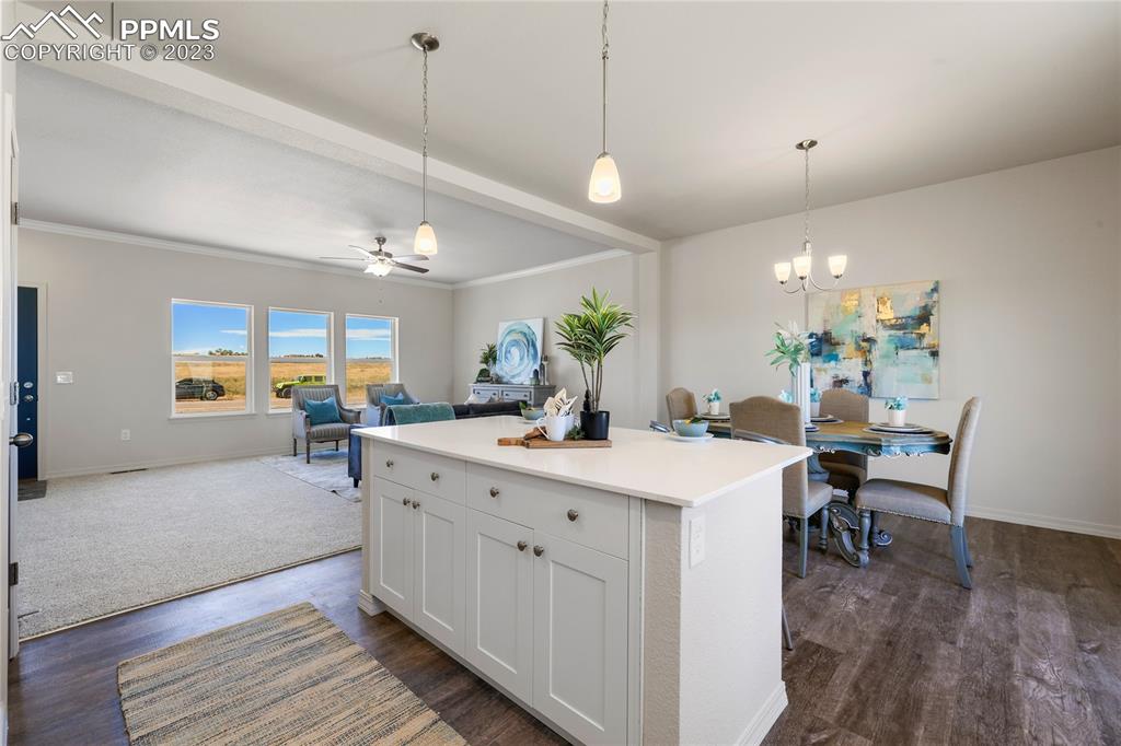 208 High Meadows Drive Florence, CO 81226 - Photo 9 of 32 a large kitchen with a table and chairs
