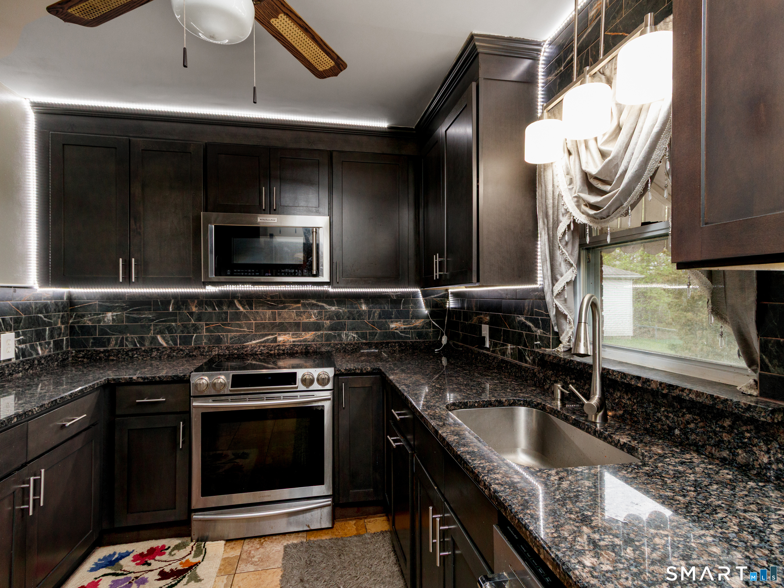 236 Hall Avenue Wallingford, CT 06492 - Photo 21 of 40 a kitchen with granite countertop a sink and a stove
