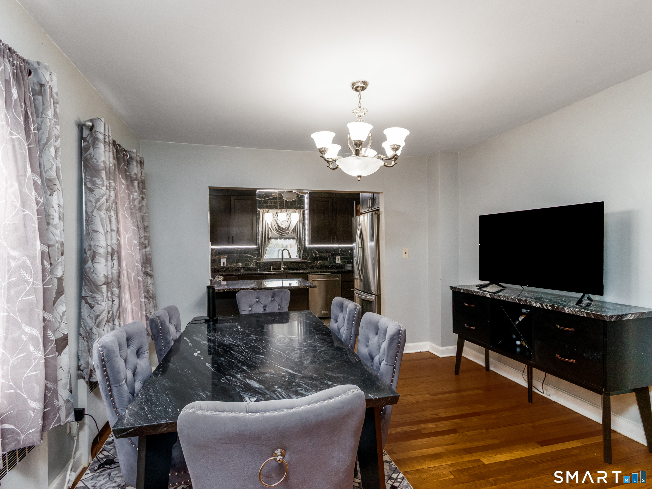 236 Hall Avenue Wallingford, CT 06492 - Photo 26 of 40 a living room with furniture and a flat screen tv