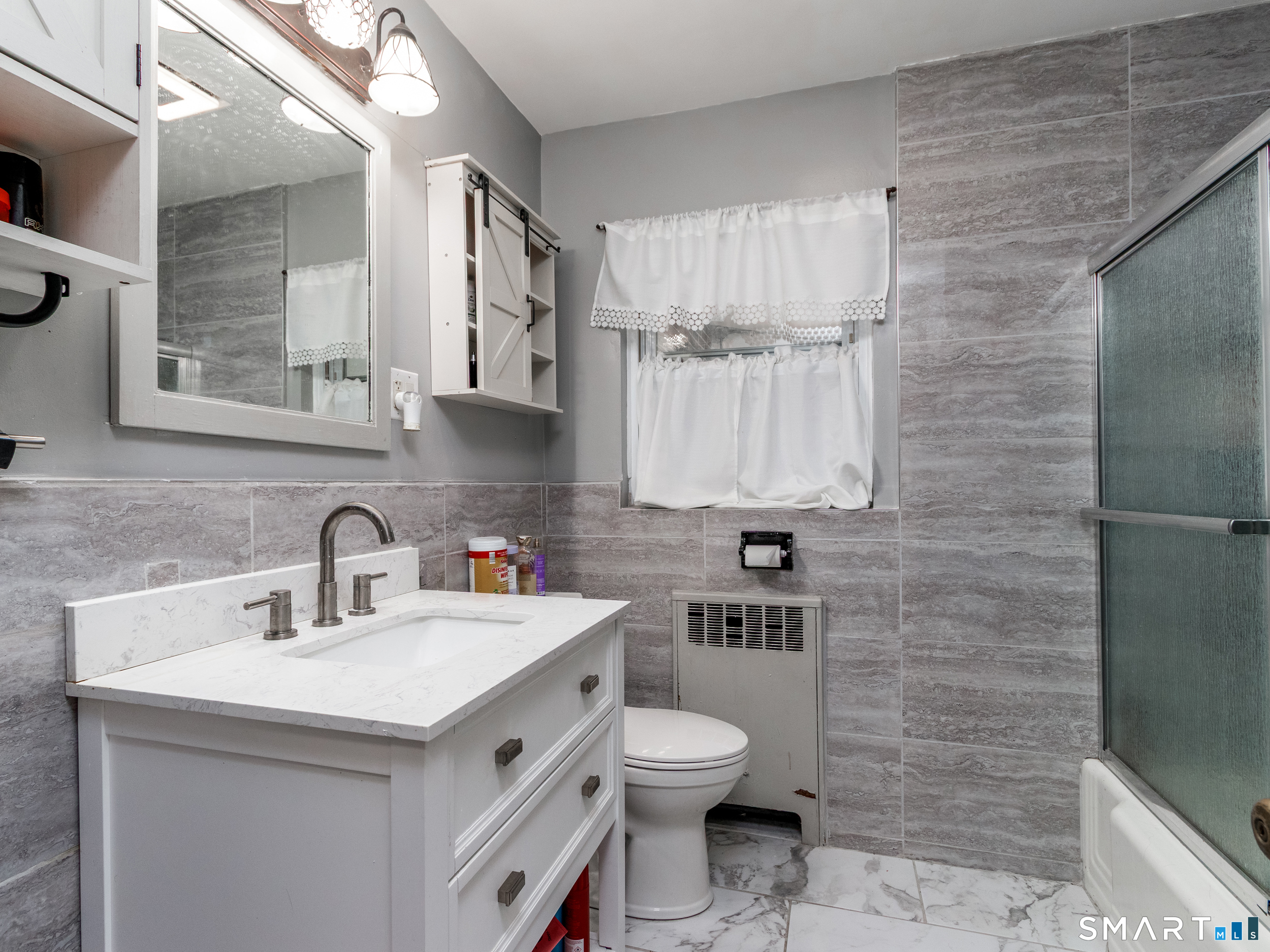 236 Hall Avenue Wallingford, CT 06492 - Photo 30 of 40 a bathroom with a sink a toilet and mirror