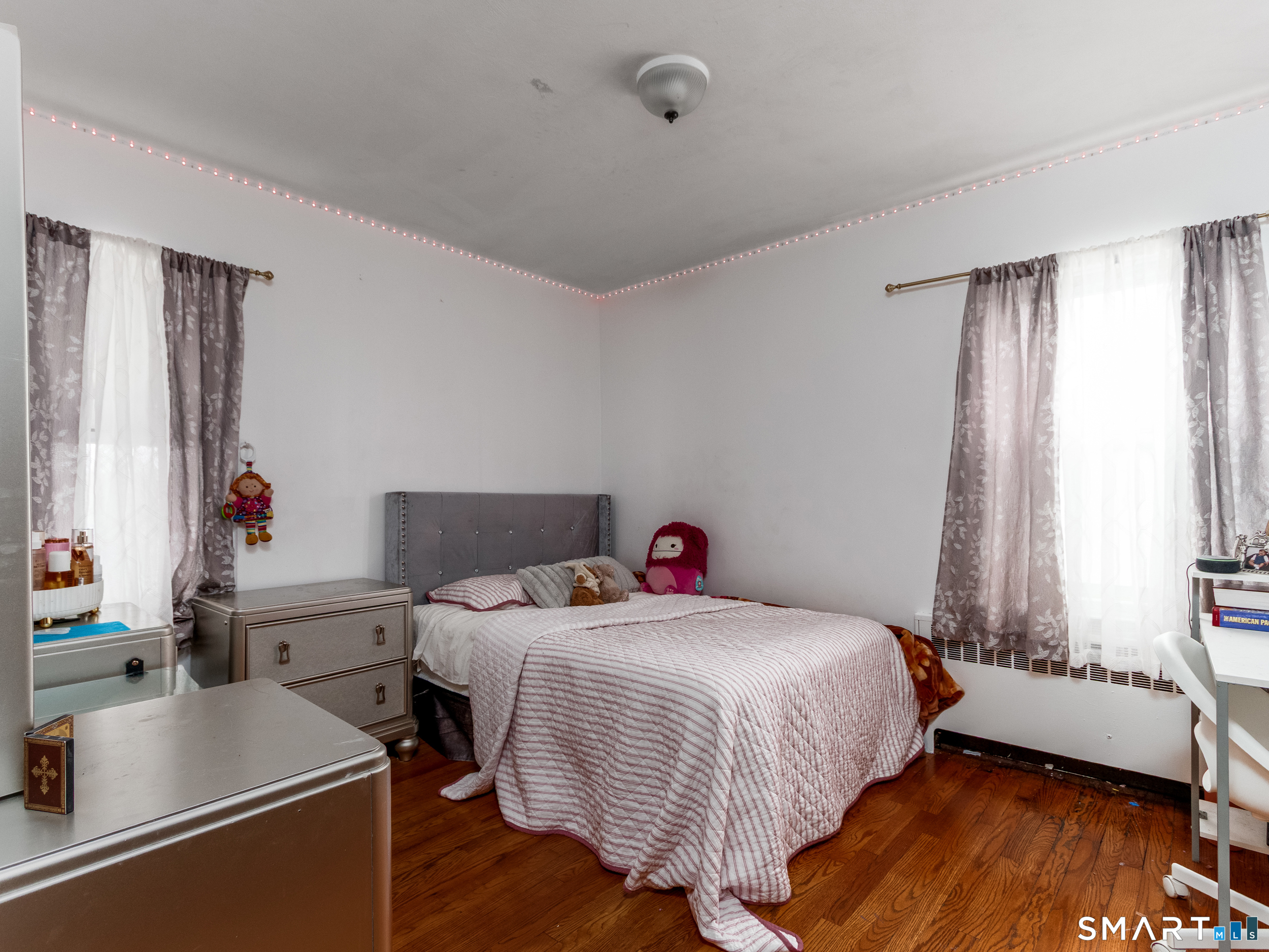 236 Hall Avenue Wallingford, CT 06492 - Photo 32 of 40 a bedroom with a bed and a large window