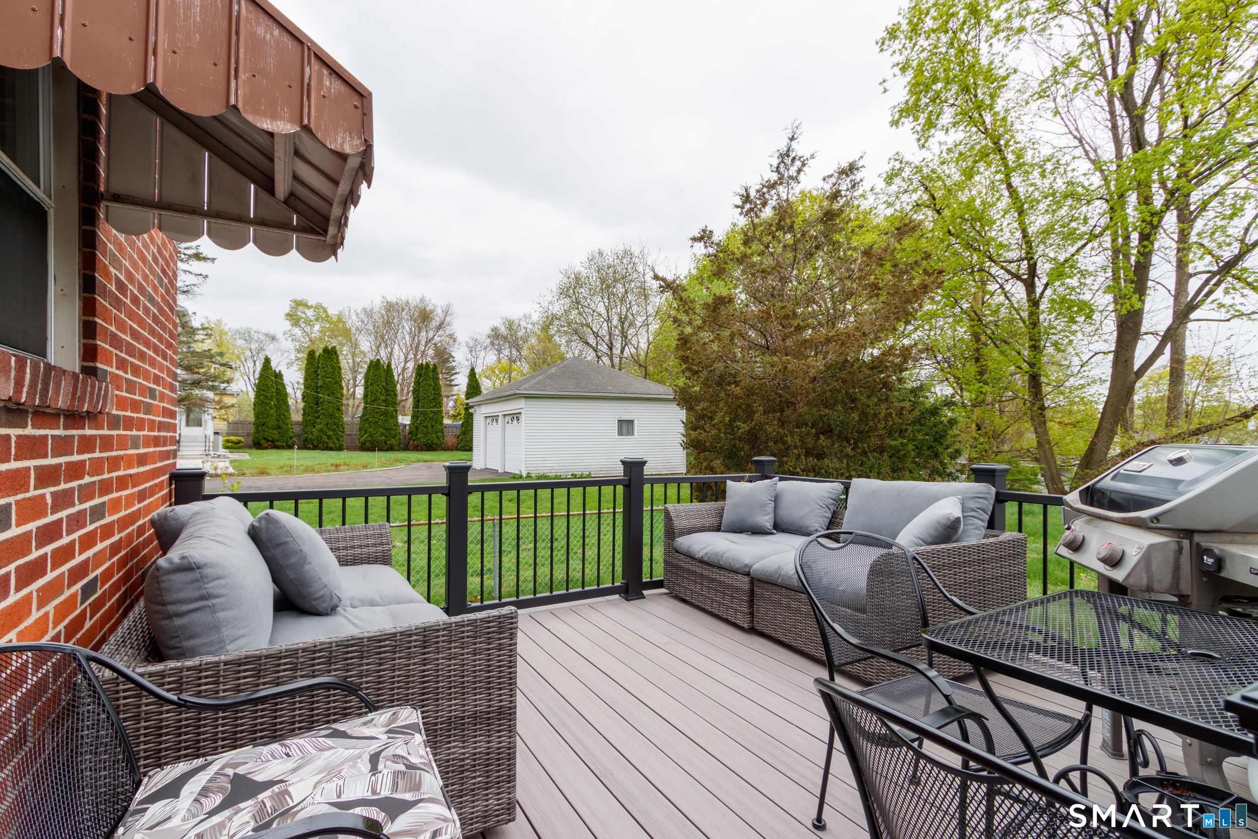 236 Hall Avenue Wallingford, CT 06492 - Photo 4 of 40 a view of a patio with couches chairs and a fire pit