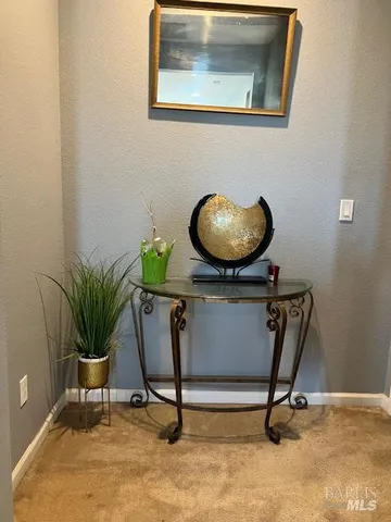 a view of entryway with a potted plant and a table