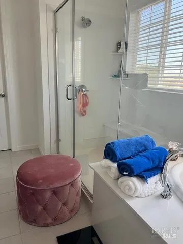 a bathroom with a tub and shower