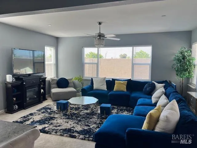 a living room with furniture or couch and a window