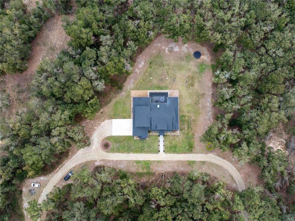 3493 Edwards Road Lady Lake, FL 32159 - Photo 2 of 5 an aerial view of a house with a yard