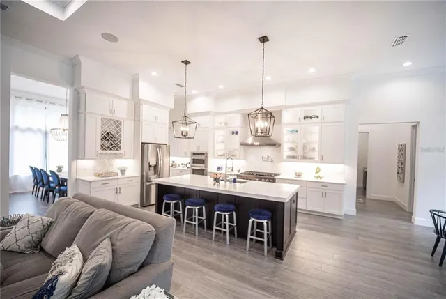 a large kitchen with a table and chairs