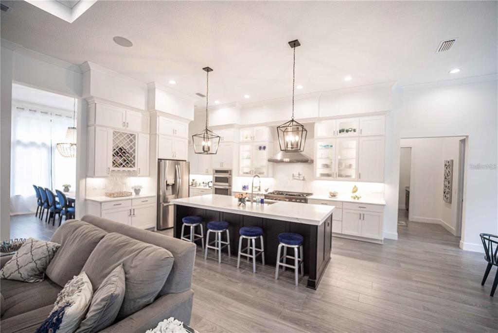 3493 Edwards Road Lady Lake, FL 32159 - Photo 4 of 5 a large kitchen with a table and chairs