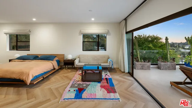 a bed room with a bed and a couch