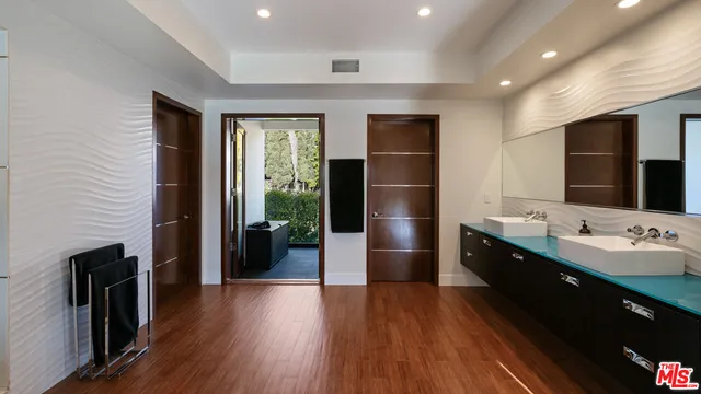 a kitchen with refrigerator and cabinets