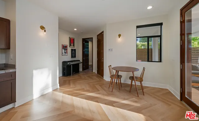 a view of a livingroom with furniture and a window