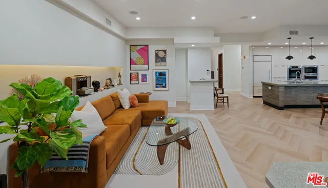 a living room with furniture and a potted plant
