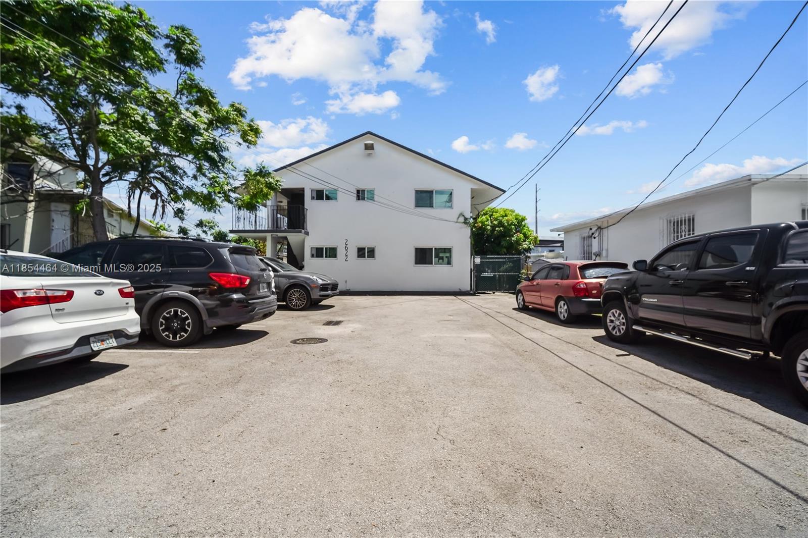 a view of a cars park in front of a house