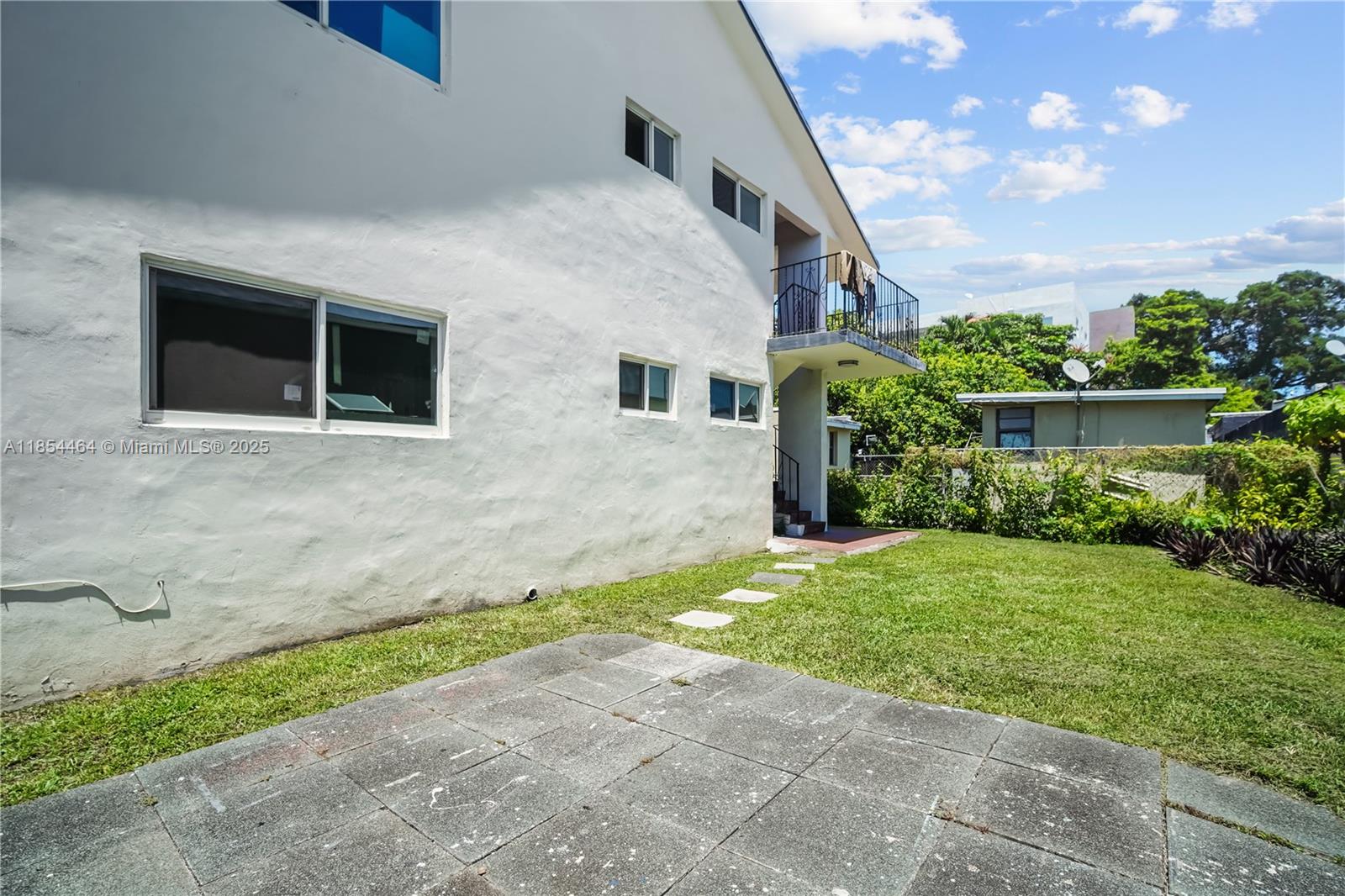 2622 Northwest 24th Street, Unit 2 Miami, FL 33142 - Photo 16 of 20 a house view with a backyard space
