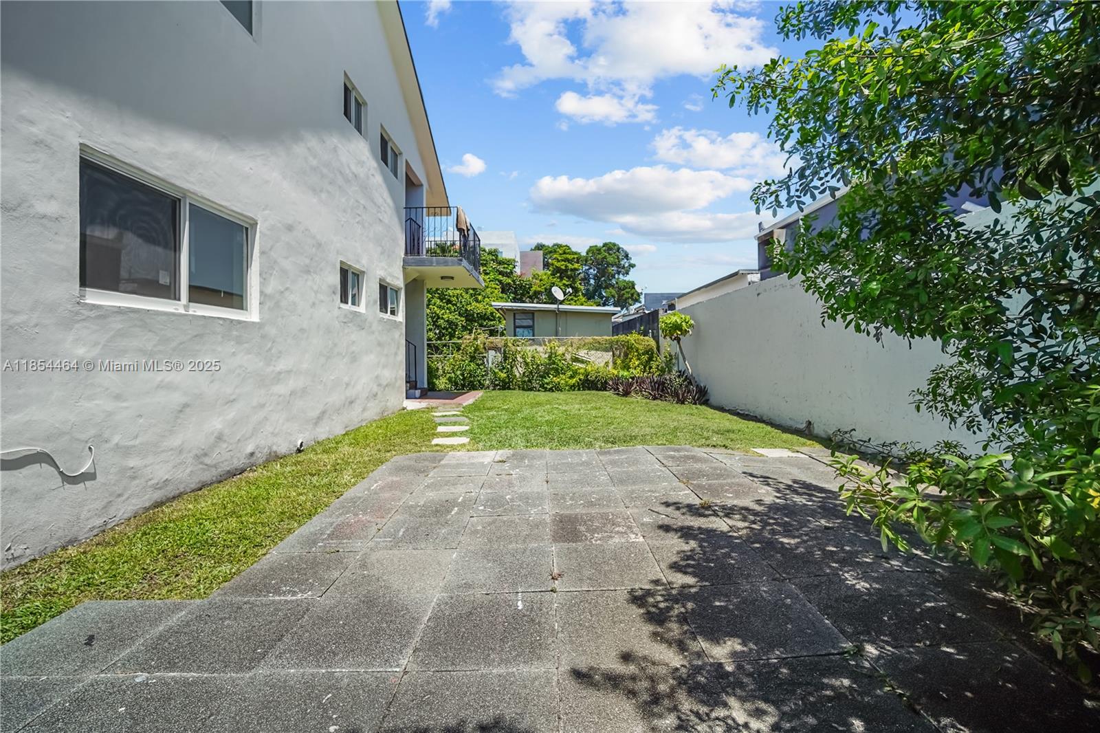 2622 Northwest 24th Street, Unit 2 Miami, FL 33142 - Photo 17 of 20 a view of a yard with potted plants