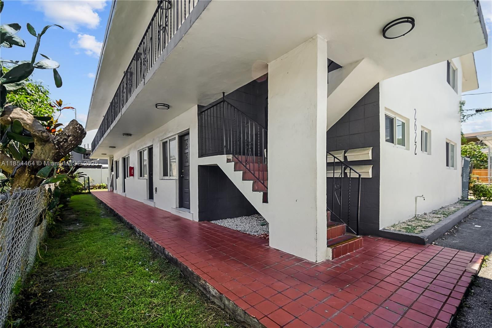 2622 Northwest 24th Street, Unit 2 Miami, FL 33142 - Photo 20 of 20 a view of a house with a yard