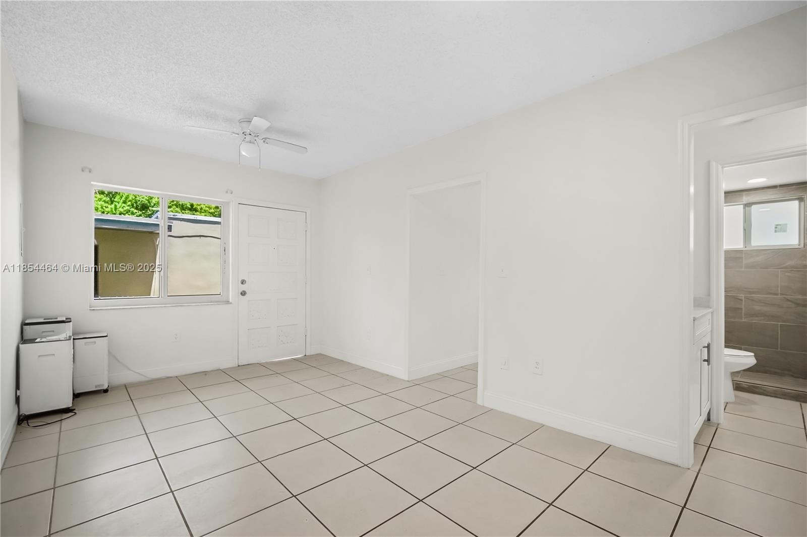 2622 Northwest 24th Street, Unit 2 Miami, FL 33142 - Photo 2 of 20 a view of an empty room and window