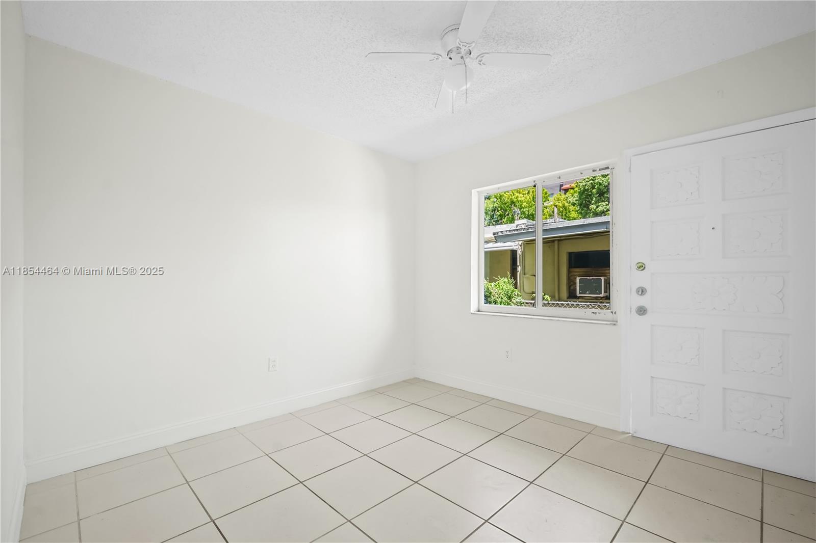 2622 Northwest 24th Street, Unit 2 Miami, FL 33142 - Photo 3 of 20 a view of an empty room with a window