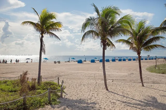 a view of swimming pool with outdoor seating