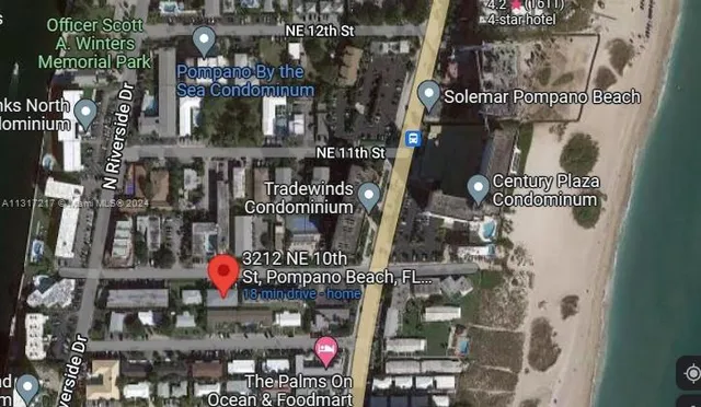 a living room with furniture and a lamp