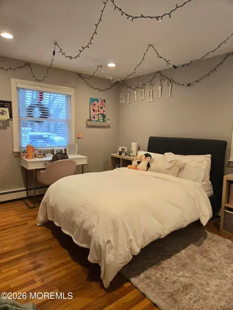 a bedroom with bed and window