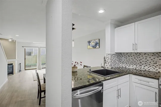 a kitchen with a sink and cabinets