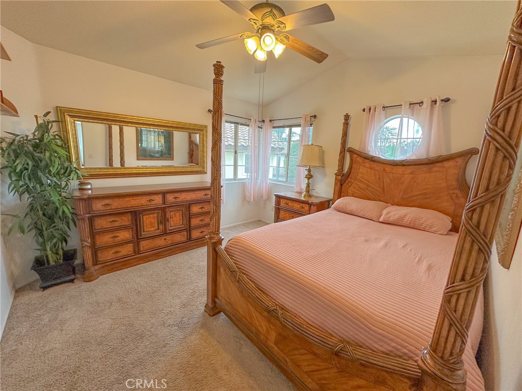 31785 Vía Del Viento Trabuco Canyon, CA 92679 - Photo 18 of 50 a bedroom with a bed and a chandelier