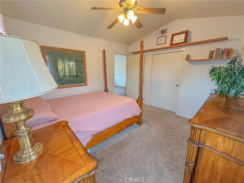 31785 Vía Del Viento Trabuco Canyon, CA 92679 - Photo 19 of 50 a bedroom with a bed and a chandelier