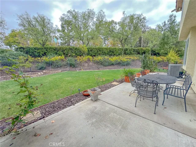 an outdoor view of a garden with seating area