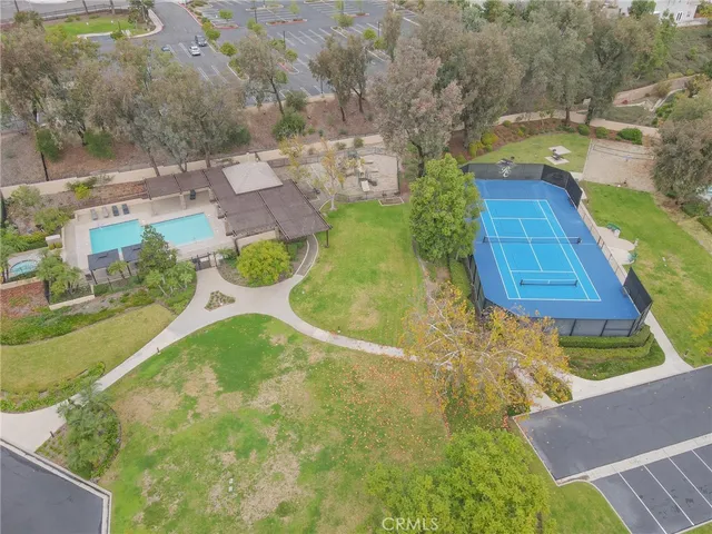 a view of a swimming pool with a yard