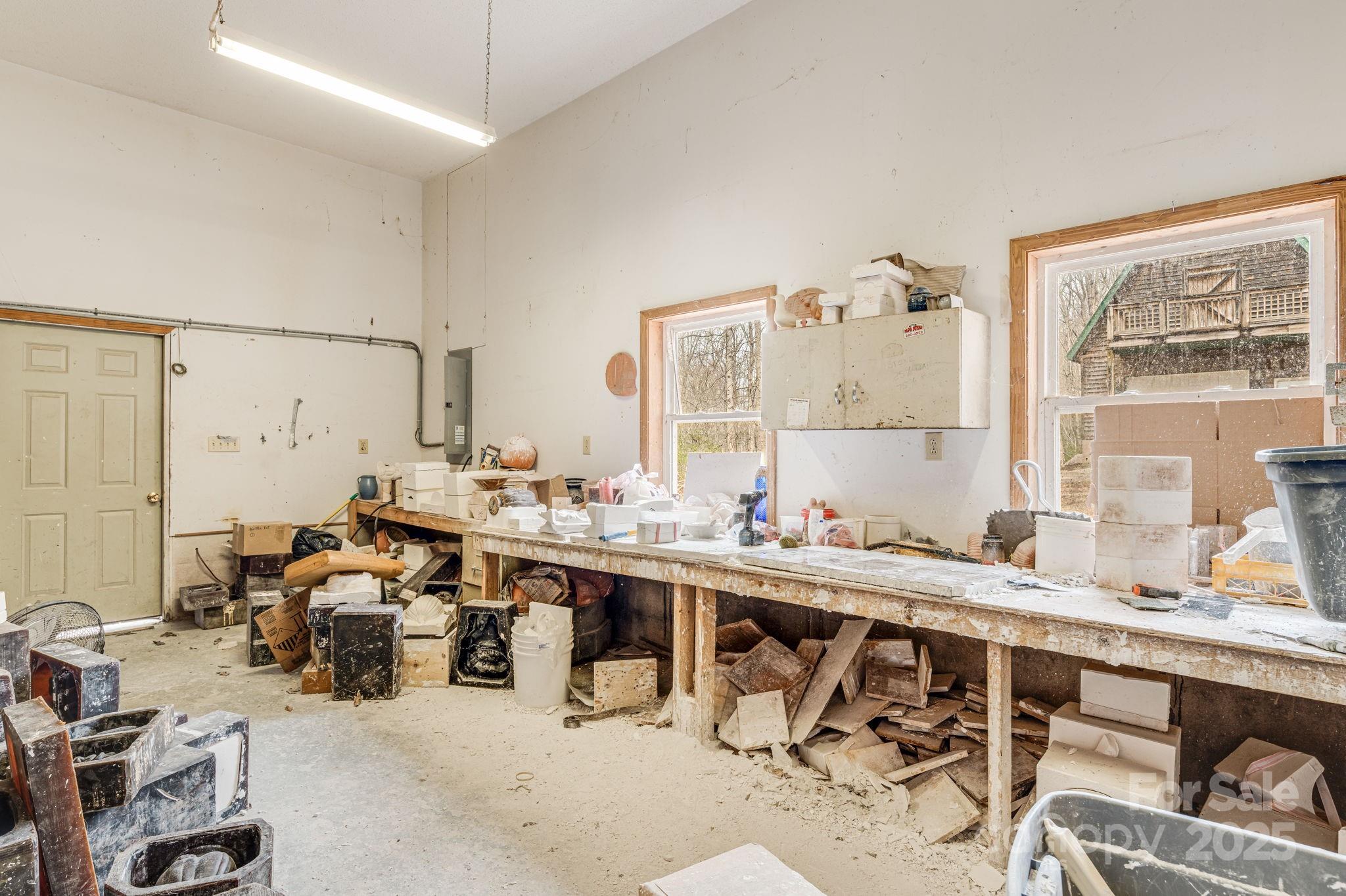 5389 Cascade Lake Road Cedar Mountain, NC 28718 - Photo 15 of 39 a room with gym equipment and a large window