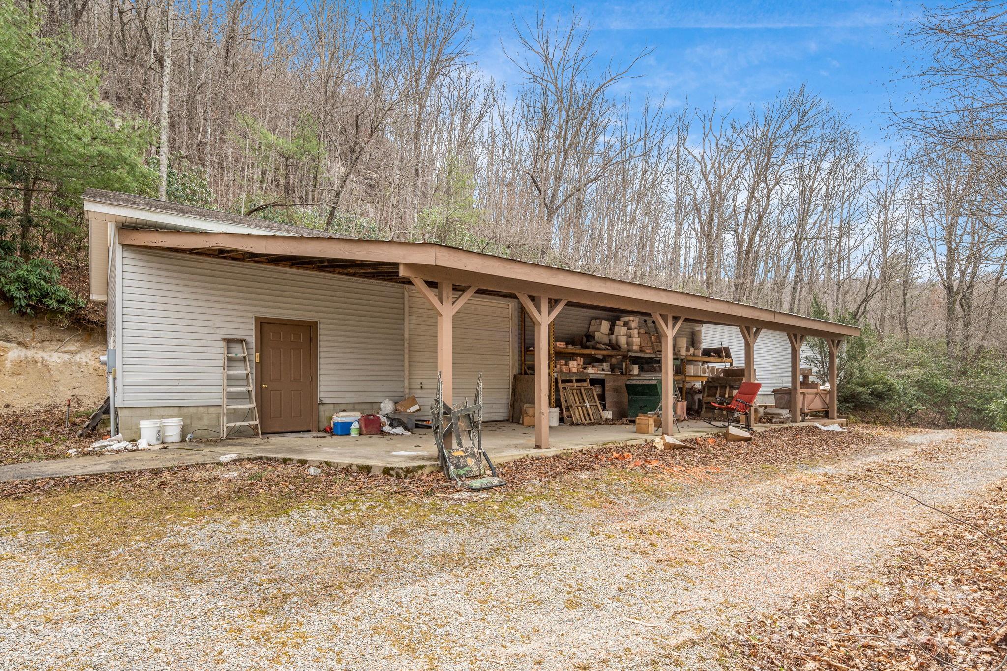 5389 Cascade Lake Road Cedar Mountain, NC 28718 - Photo 10 of 39 a backyard of a house with yard and seating space