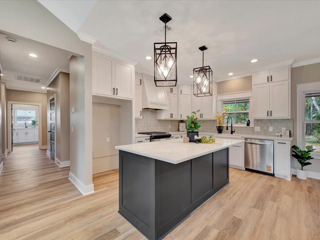 537 C C Road Diboll, TX 75941 - Photo 11 of 37 a kitchen with kitchen island granite countertop a sink refrigerator and cabinets