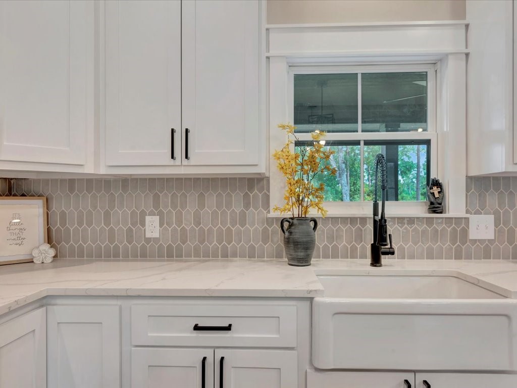 537 C C Road Diboll, TX 75941 - Photo 14 of 37 a kitchen with a sink and a window