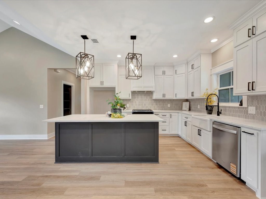 537 C C Road Diboll, TX 75941 - Photo 15 of 37 a large kitchen with stainless steel appliances a large center island and cabinets