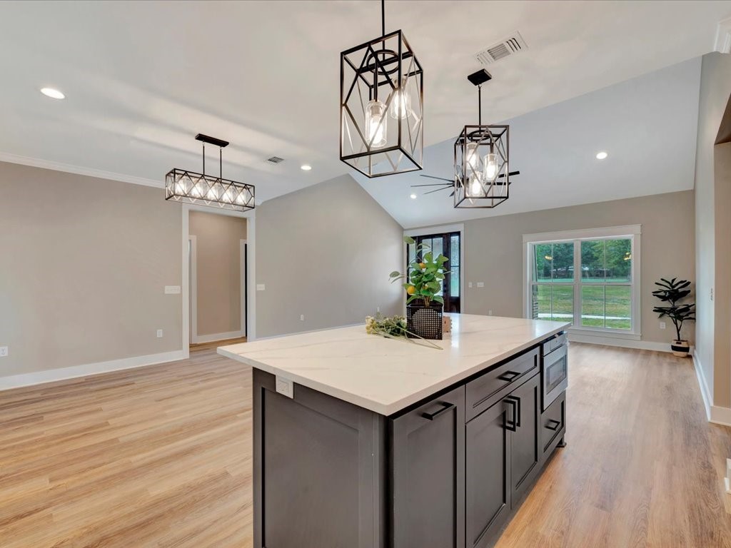 537 C C Road Diboll, TX 75941 - Photo 17 of 37 a kitchen that has a table chairs and wooden floor