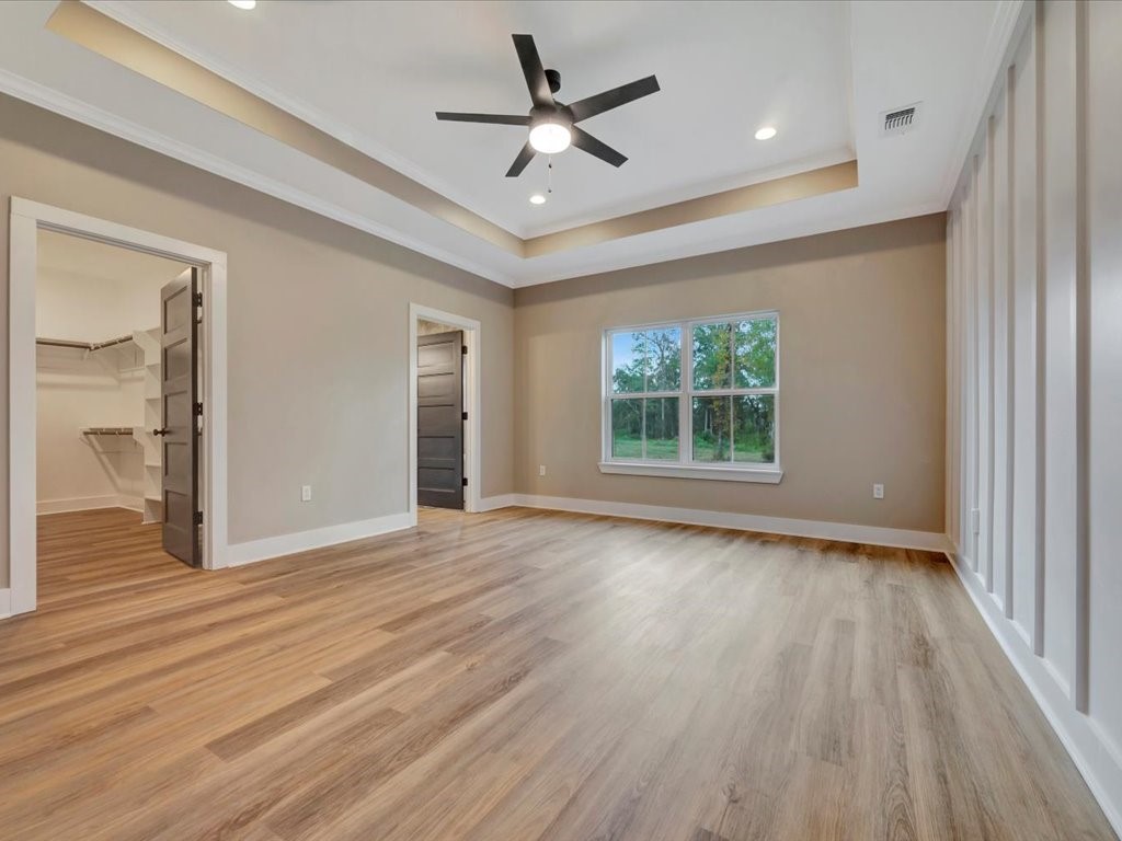 537 C C Road Diboll, TX 75941 - Photo 21 of 37 a view of an empty room with wooden floor and a window