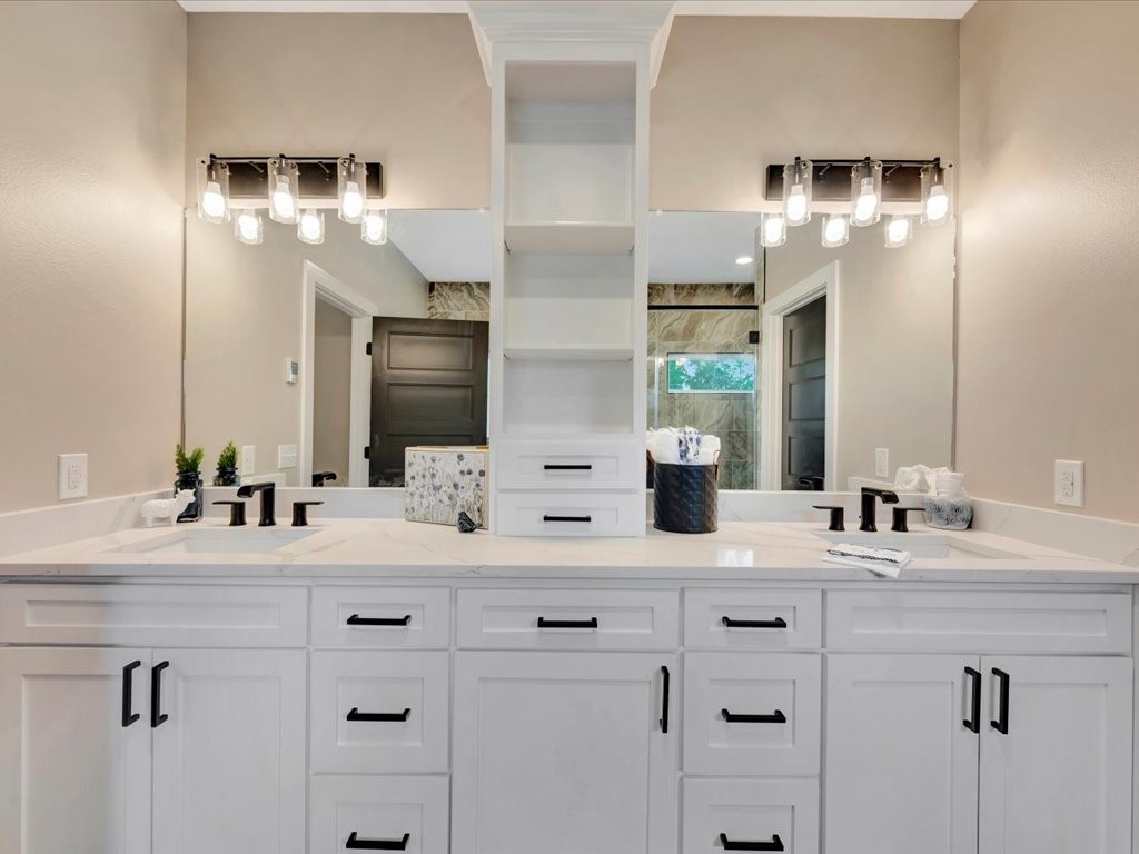 537 C C Road Diboll, TX 75941 - Photo 24 of 37 a bathroom with double vanity and a mirror